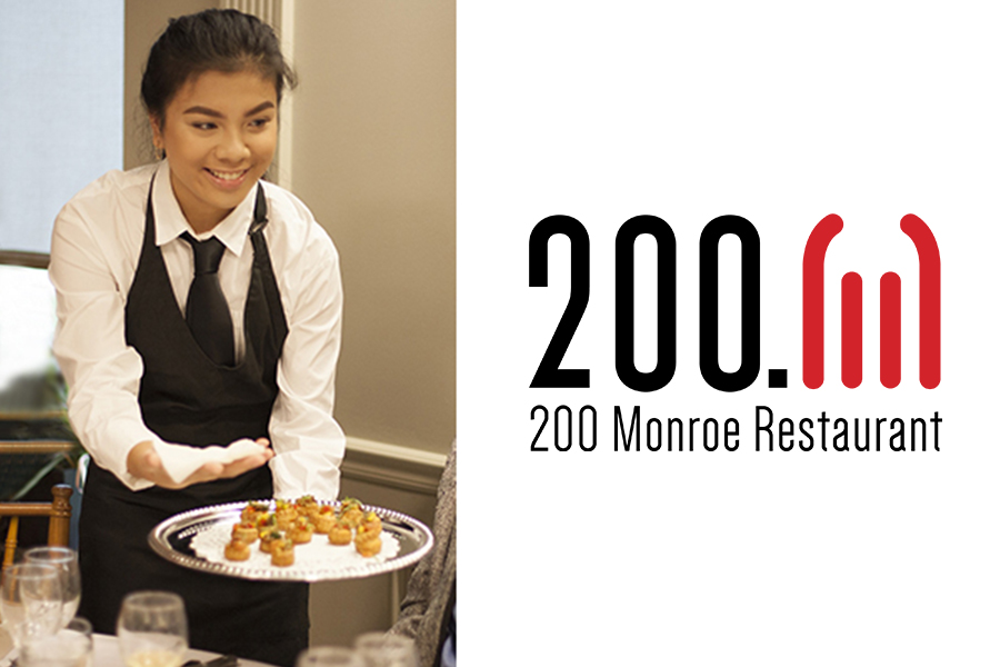 A split image featuring a smiling server in a black vest and tie presenting a tray of hors d'oeuvres on the left, and the 200 Monroe Restaurant logo with a red arched icon on the right.