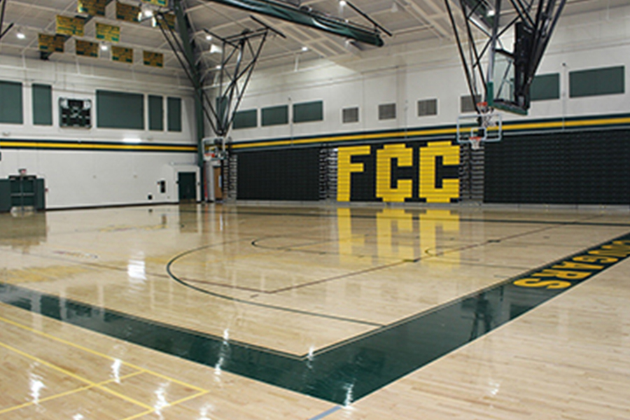empty gym with FCC logo on the wall