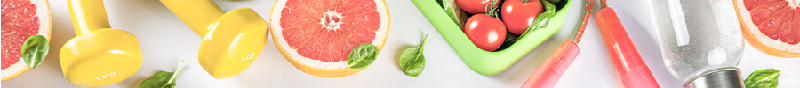 Top view of fitness and healthy living items including yellow dumbbells, grapefruit, leafy greens, cherry tomatoes, and a jump rope on a light background. Top view of fitness and healthy living items including yellow dumbbells, grapefruit, leafy greens, cherry tomatoes, and a jump rope on a light background.